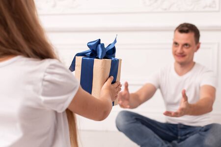 Little girls giving giftbox to her father at fathers day. Selective focusの写真素材