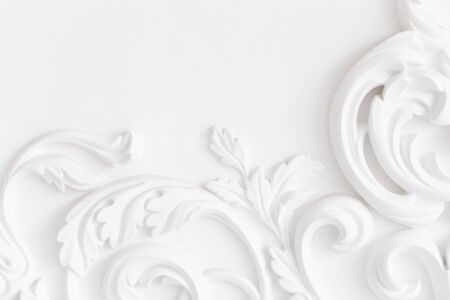 Beautiful ornate white decorative plaster moldings in studio.の写真素材