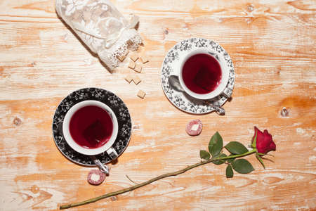 two cups of tea and red roseの写真素材