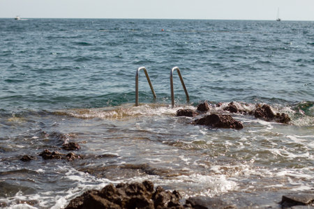 ladder entrance into the oceanの写真素材
