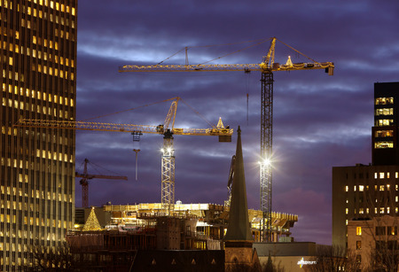 Tower cranes decorated with Christmas lights