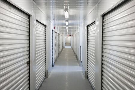 A perspective view down a corridor of storage units