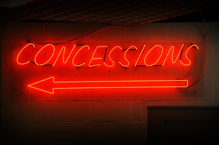 Red neon concessions signs with arrow.のeditorial素材