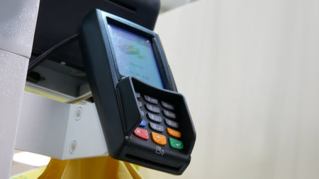 Close-up of a payment terminal at a self-service checkout