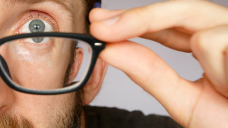 Close-up of a face of a man trying on the glasses