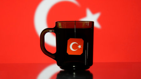 Close-up of a cup of tea with a Turkey flag tag hanging from itの写真素材