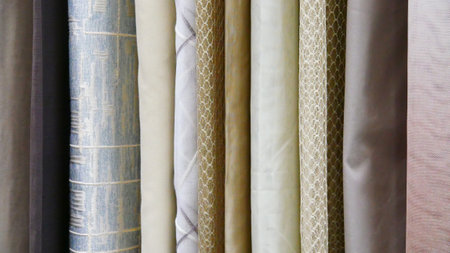 Close-up of many different curtains or tableclothsの写真素材