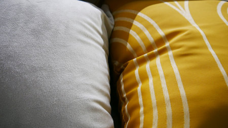 Close-up of two different pillows next to each otherの写真素材