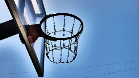 A nice street basketball hoop against blue sky