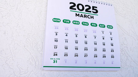 Close-up of marked Eid al-Fitr date 2025 on a wall calendarの写真素材