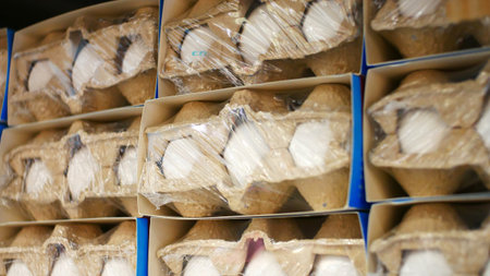 Many eggs packs standing in rows
