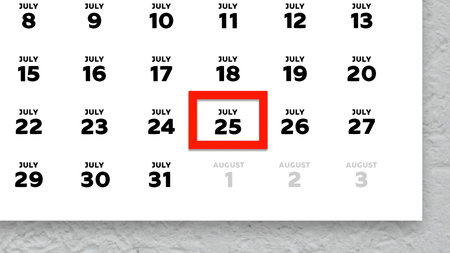 Close-up of the date July 25th marked with a red cursor on the wall calendar 2025