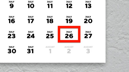 Close-up of the date July 26th marked with a red cursor on the wall calendar 2025