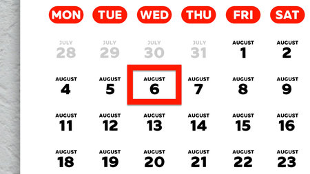 Close-up of the date August 6th marked with a red cursor on the wall calendar 2025