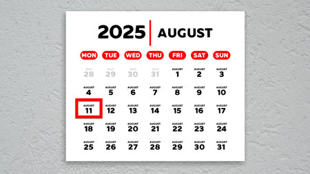 The date August 11th marked with a red cursor on the wall calendar 2025