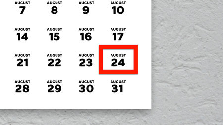 Close-up of the date August 24th marked with a red cursor on the wall calendar 2025