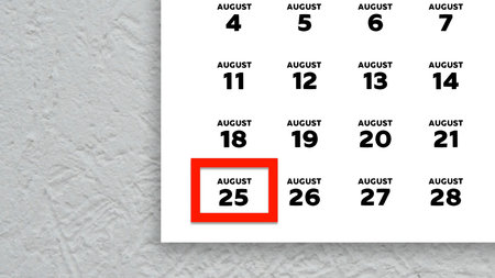 Close-up of the date August 25th marked with a red cursor on the wall calendar 2025の写真素材