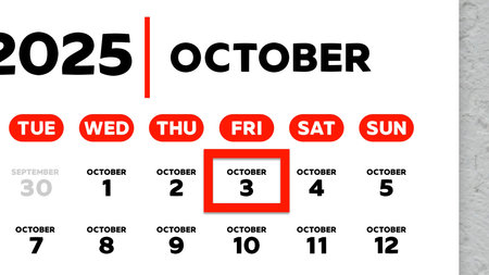 Close-up of the date October 3rd marked with a red cursor on the wall calendar 2025