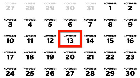 Close-up of the date November 13th marked with a red cursor on the wall calendar 2025の写真素材