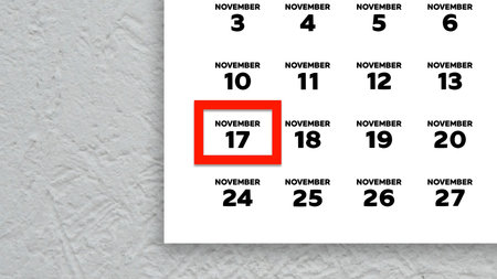 Close-up of the date November 17th marked with a red cursor on the wall calendar 2025