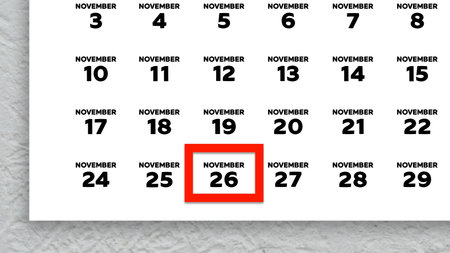 The date November 26th marked with a red cursor on the wall calendar 2025の写真素材