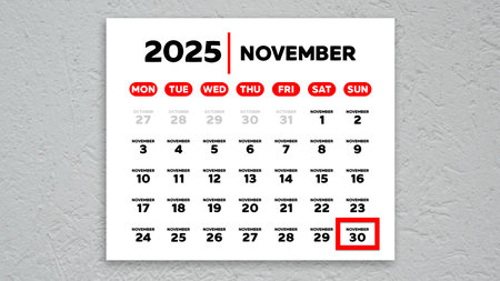 The date November 30th marked with a red cursor on the wall calendar 2025