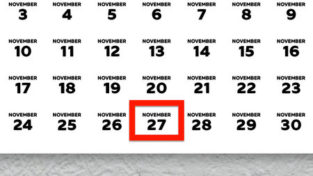 Close-up of the date November 27th marked with a red cursor on the wall calendar 2025の写真素材