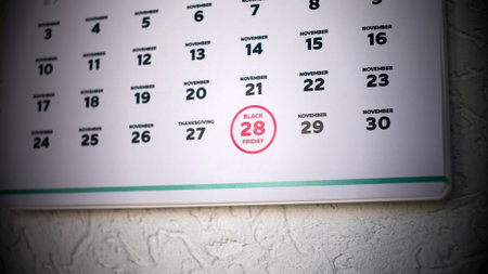 Close-up of Black Friday date 2025 on a wall calendar pageの写真素材
