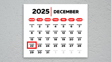 The date December 22nd marked with a red cursor on the wall calendar 2025