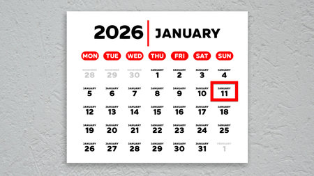 The date January 11th marked with a red cursor on the wall calendar 2026