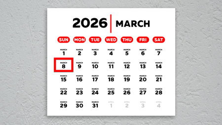 The date March 8th marked with a red cursor on the wall calendar 2026の写真素材
