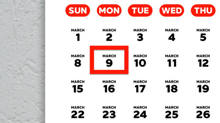 Close-up of the date March 9th marked with a red cursor on the wall calendar 2026の写真素材