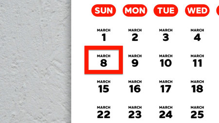 Close-up of the date March 8th marked with a red cursor on the wall calendar 2026の写真素材
