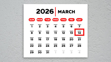 The date March 14th marked with a red cursor on the wall calendar 2026の写真素材