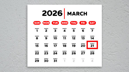The date March 21st marked with a red cursor on the wall calendar 2026