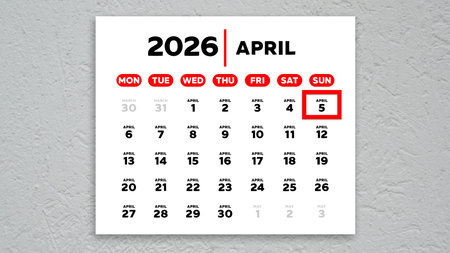 The date April 5th marked with a red cursor on the wall calendar 2026