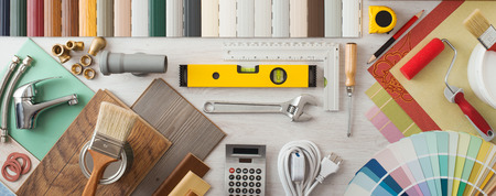 Do it yourself, home renovation and construction concept with DIY tools, hardware and swatches on wooden table, top view Do it yourself, home renovation and construction concept with DIY tools, hardware and swatches on wooden table, top view