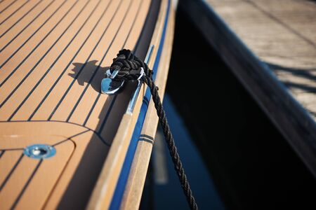 Moored luxury ship at the harbor: mooring rope close up