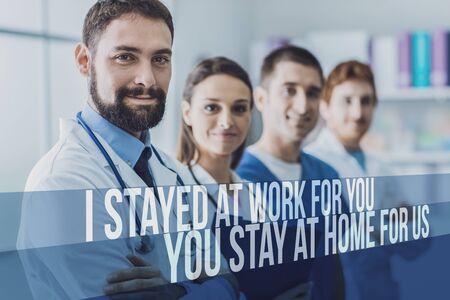 Medical team standing together and fighting Coronavirus with awareness message: I stayed at work for...