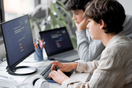 Young students using computers in the lab, learning and technology conceptの写真素材