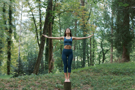 Woman standing and balancing, meditation and healthy lifestyle conceptの写真素材