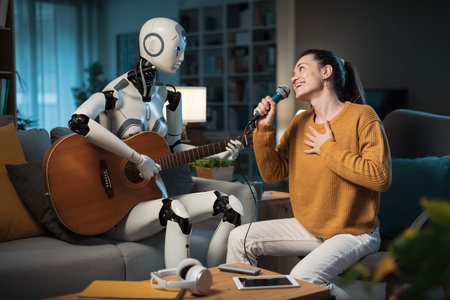 A cute young girl enjoys her AI-equipped Domestic Robot playing Karaoke. He plays the guitar, and...