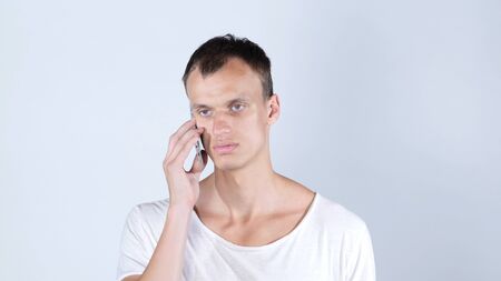 A handsome businessman calling by the phoneの写真素材