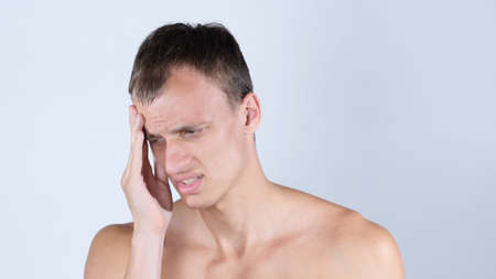 Portrait of Shirtless Man, Suffering from Headacheの写真素材