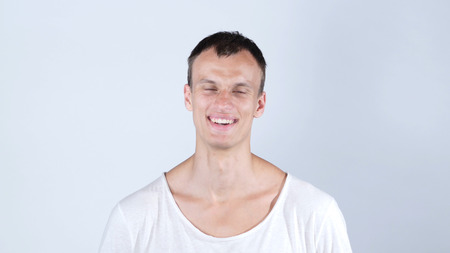 Young happy man laughing at camera , smiling portraitの写真素材