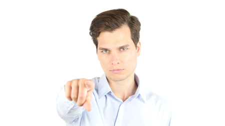 Happy attractive young man pointing at youの写真素材