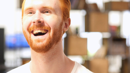 Portrait of young happyRed Hair Beard Man Laughing Loudの写真素材