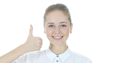 Thumbs Up By Beautiful Young Woman, White Backgroundの写真素材