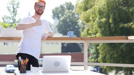 Thumbs Up, Designer Standing in Balcony of Office Outdoor, Gestureの写真素材