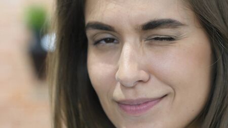 Winking Eye, Close Up of Beautiful Lovely Girl Faceの写真素材